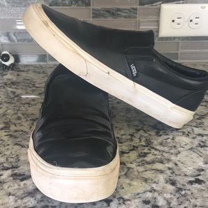 Shiny black Vans slip on sneakers